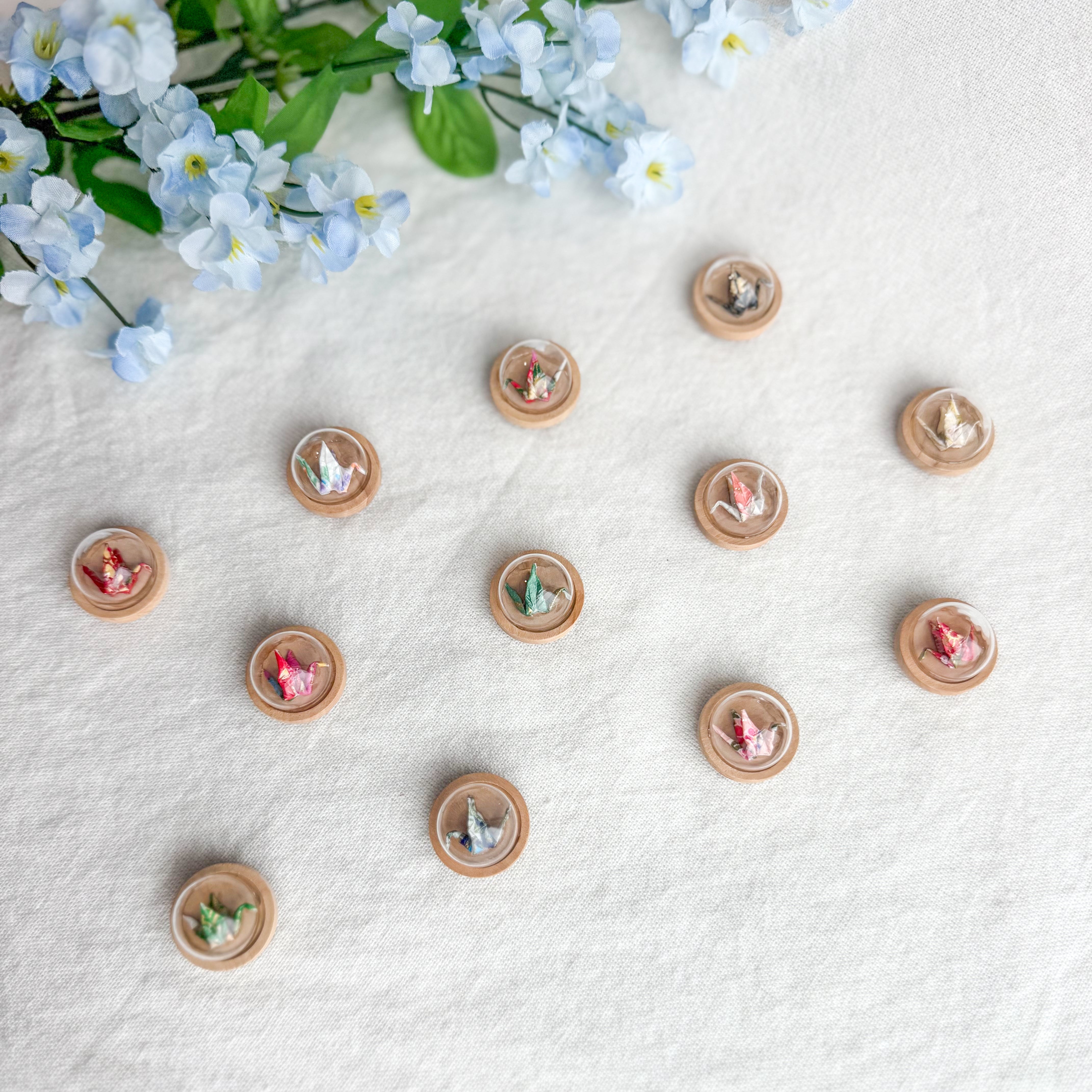 Tiny origami crane magnets flatlay