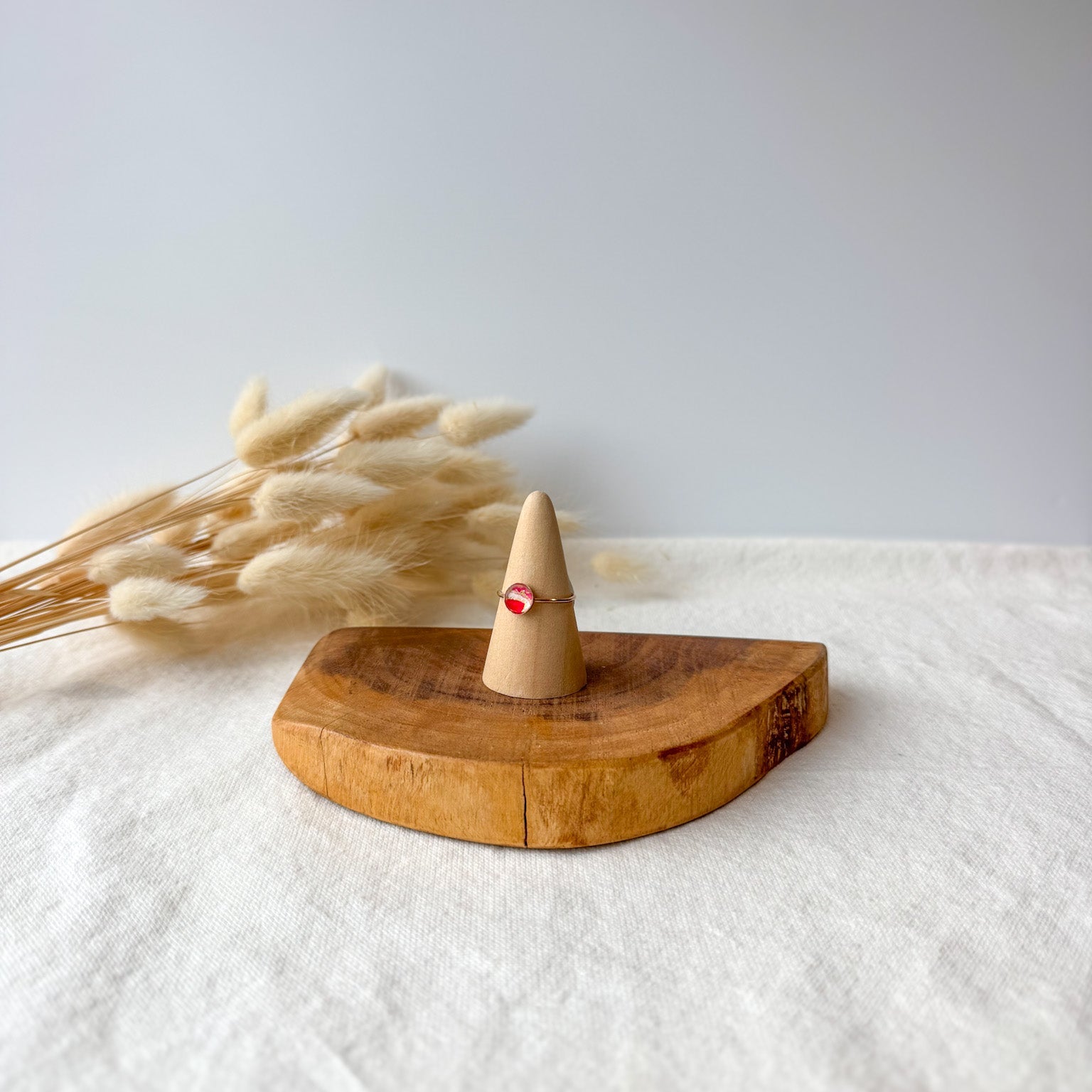 Wooden ring holder with a dainty ring