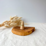 Wooden ring holder with a dainty ring