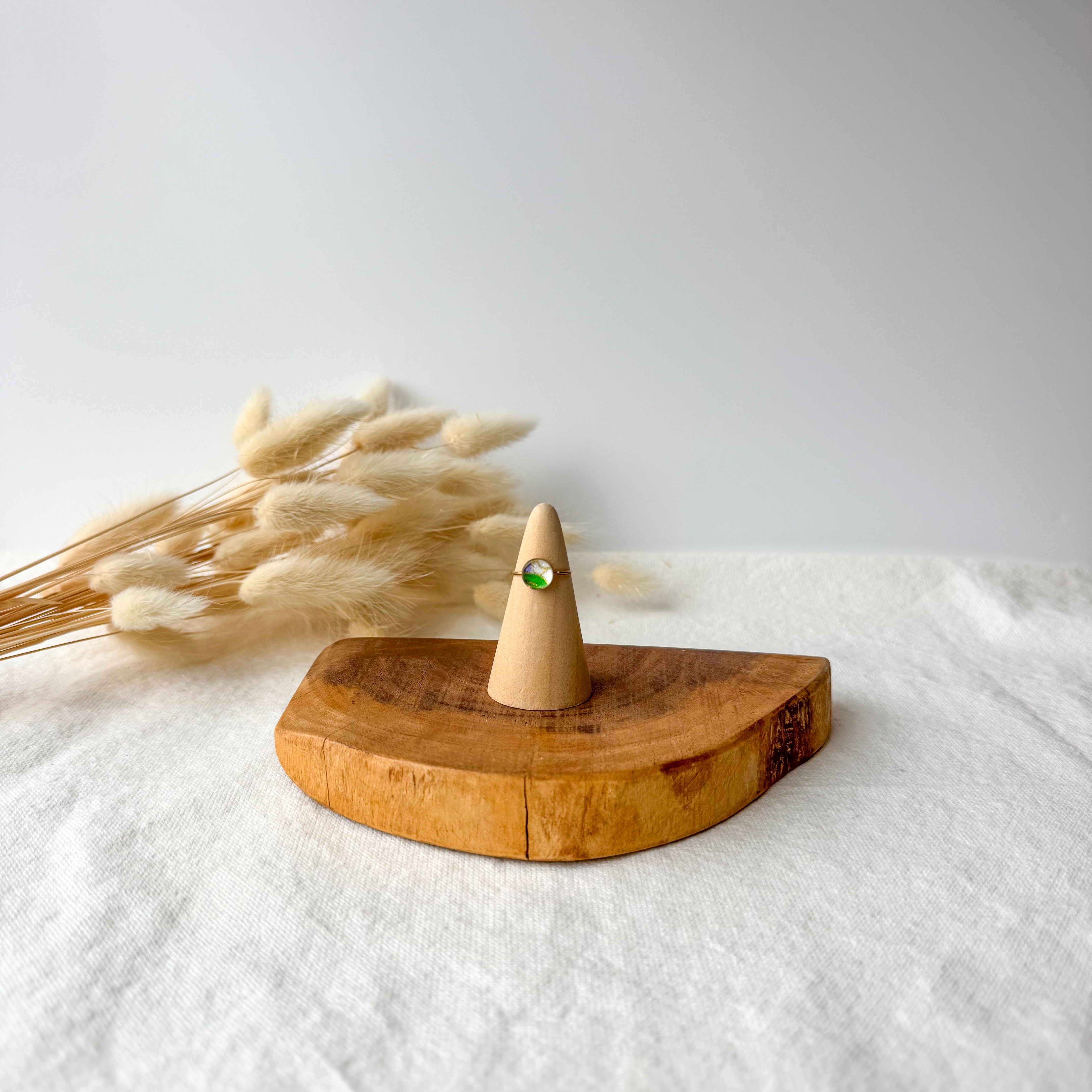Wooden ring holder with a dainty ring