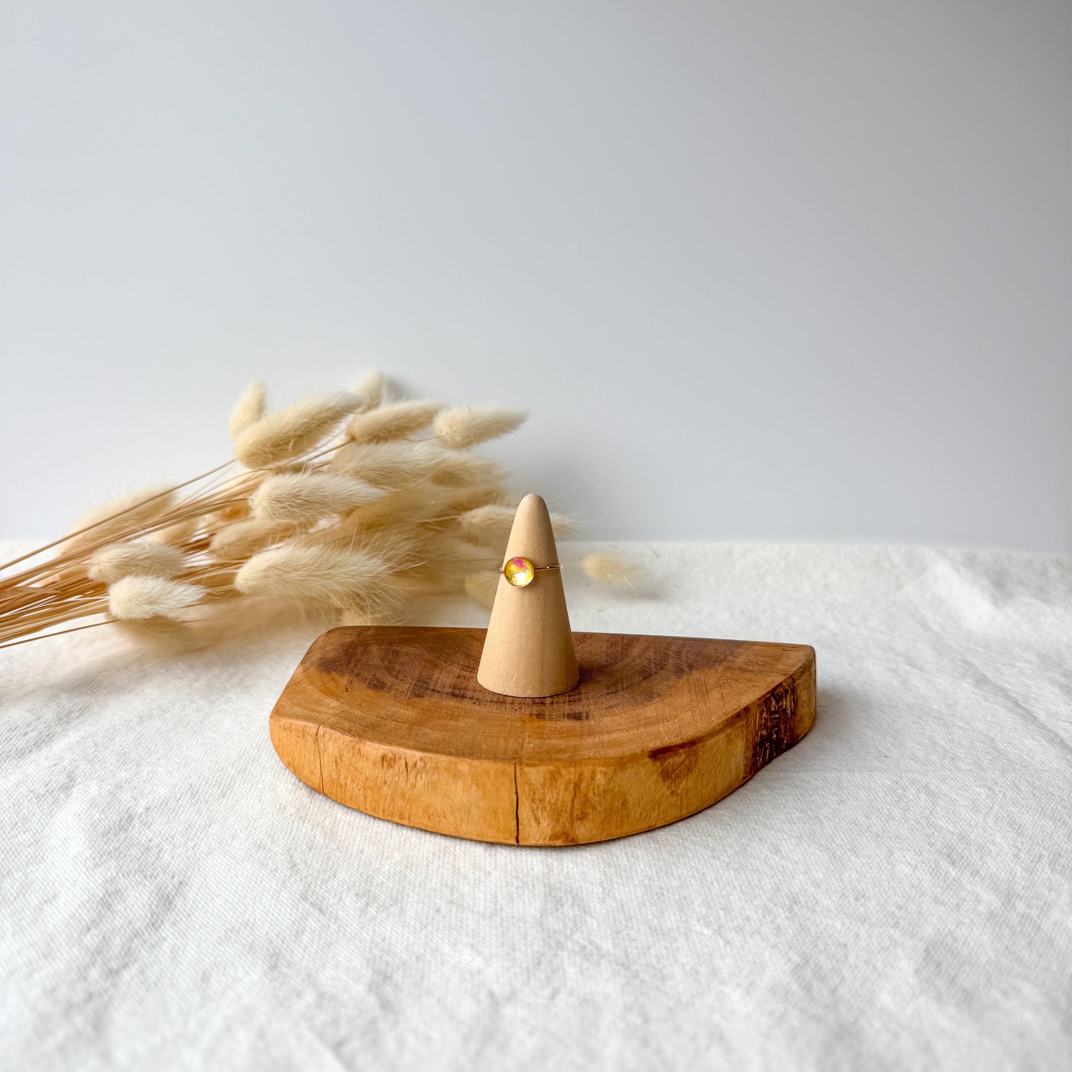Wooden ring holder with a dainty ring
