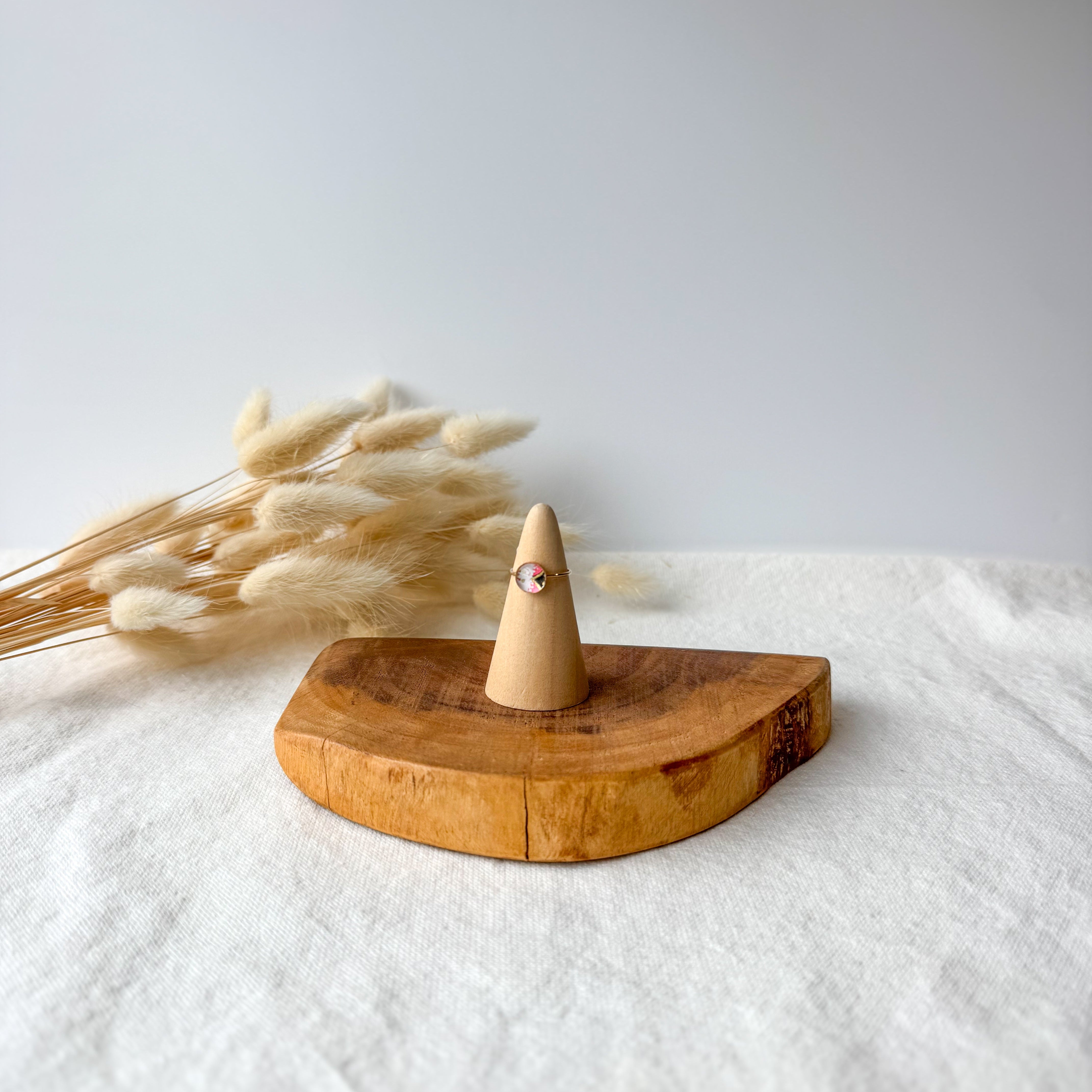 Wooden ring holder with a dainty ring