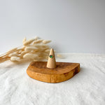 Wooden ring holder with a dainty ring