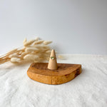 Wooden ring holder with a dainty ring