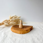 Wooden ring holder with a dainty ring