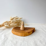 Wooden ring holder with a dainty ring