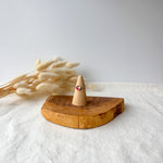 Wooden ring holder with a dainty ring
