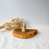 Wooden ring holder with a dainty ring