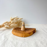 Wooden ring holder with a dainty ring