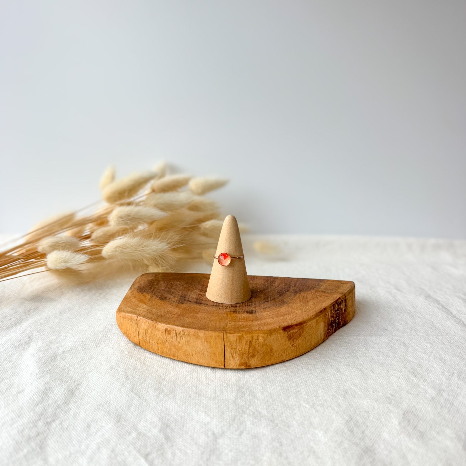 Wooden ring holder with a dainty ring
